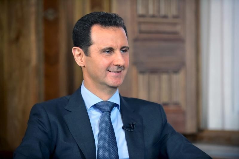 © Reuters. Syria's President Bashar al-Assad answers questions during an interview with al-Manar's journalist Amro Nassef, in Damascus