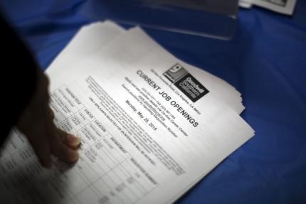 © Reuters. File photo of job opening listings are distributed during job fair for homeless at Los Angeles Mission in the Skid Row area of Los Angeles, California.