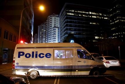 © Reuters. Police van blocks a street outside the New South Wales (NSW) state police headquarters located in the Sydney suburb of Parramatta