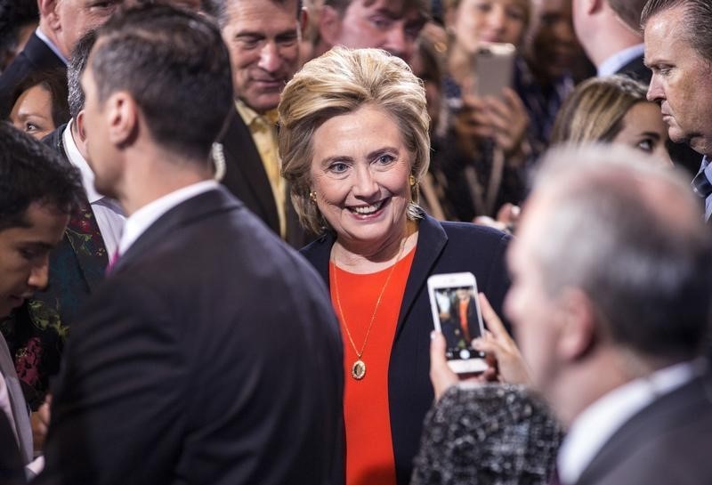 © Reuters. Democratic presidential candidate Hillary Clinton has a picture taken by a supporter after speaking at the Human Rights Campaign Breakfast in Washington