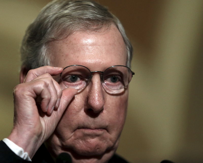 © Reuters. Senate Majority Leader McConnell adjusts glasses while taking questions on the upcoming budget battleon Capitol Hill in Washington