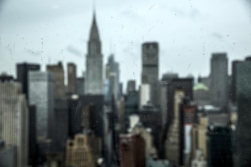 © Reuters. Midtown Manhattan is seen through a window covered in rain drops from the United Nations Secretariat Building in Manhattan, New York