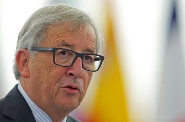 © Reuters. European Commission President Juncker addresses the European Parliament during a debate on the results of the last informal European Council, in Strasbourg