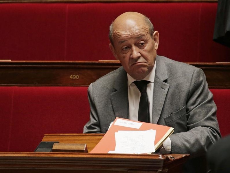 © Reuters. French Defence Minister Le Drian attends the questions to the government session at the National Assembly in Paris