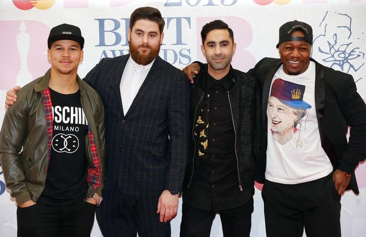 © Reuters. Pop group Rudimental members Piers Agget, Kesi Dryden, Amir Amor and DJ Locksmith arrive  for the BRIT music awards at the O2 Arena in London