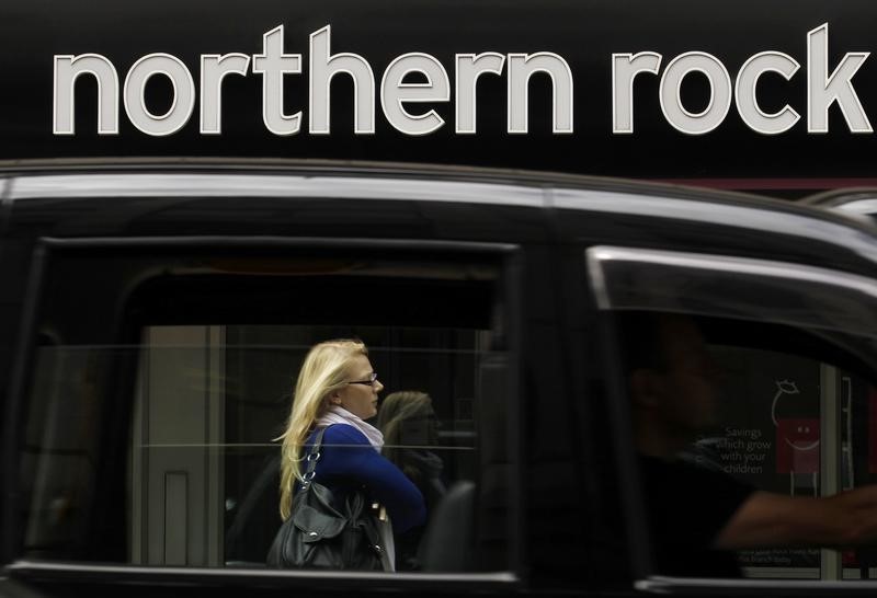 © Reuters. A black cab drives past a branch of Northern Rock in the City of London
