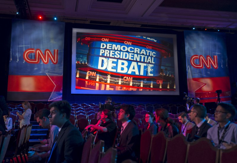 © Reuters. Reporters get a tour of the room where democratic presidential candidates will debate at the Wynn Hotel in Las Vegas