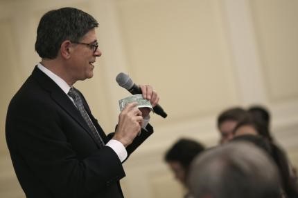 © Reuters. U.S. Treasury Secretary Jack Lew holds a two dollar note as he speaks during an event about currency redesign hosted by the University of Maryland in College Park, Maryland