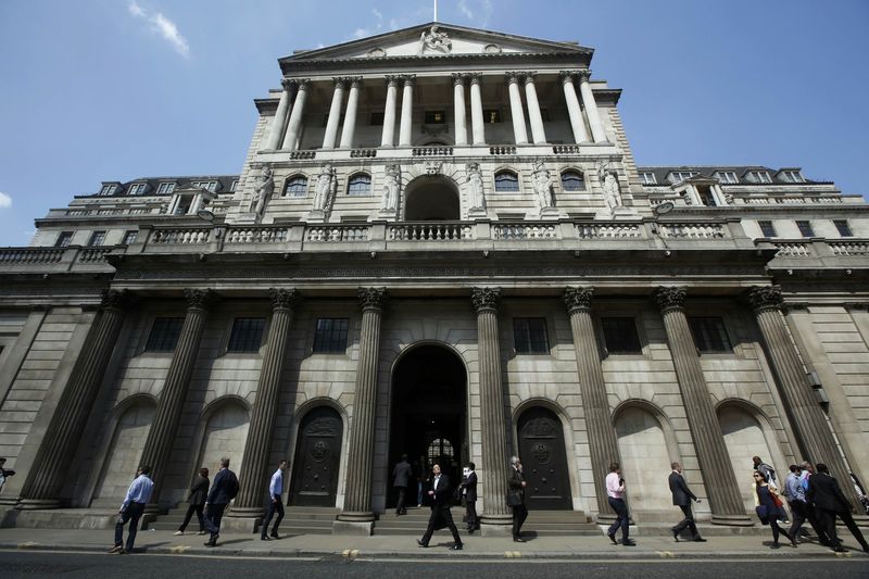 © Reuters. File photograph of pedestrians walking past the Bank of England in the City of London