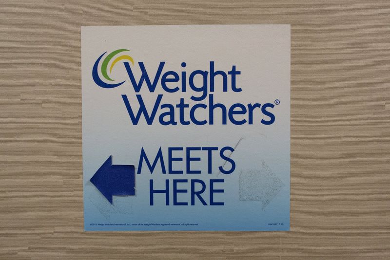 © Reuters. Sign for Weight Watchers is displayed at an office in New York