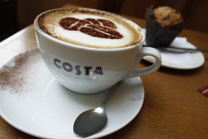 © Reuters. A cup of cappuccino stands on a table at a branch of Costa coffee in Knutsford