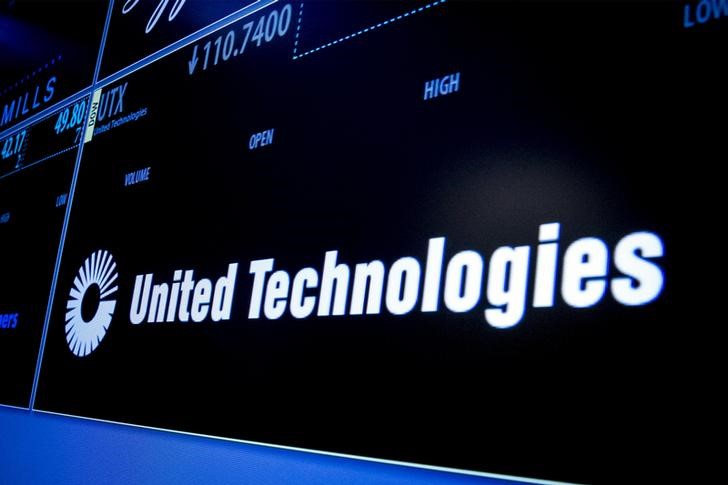 © Reuters. Ticker symbol for United Technologies is displayed on a screen on the floor of the New York Stock Exchange 