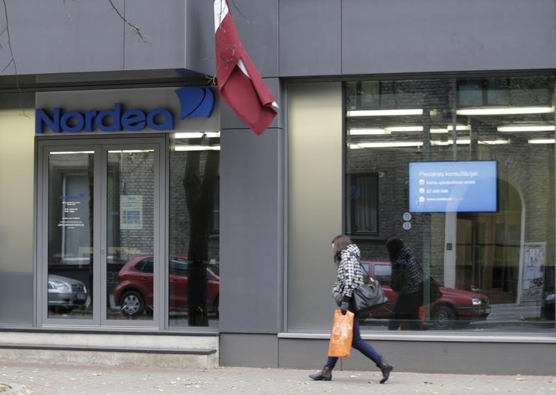 © Reuters. A woman walks past Nordea bank Latvia's branch headquarters in Riga
