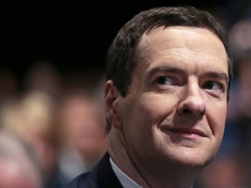 © Reuters. Britain's Chancellor George Osborne waits to listen to Prime Minister David Cameron deliver his keynote address at the annual Conservative Party Conference in Manchester