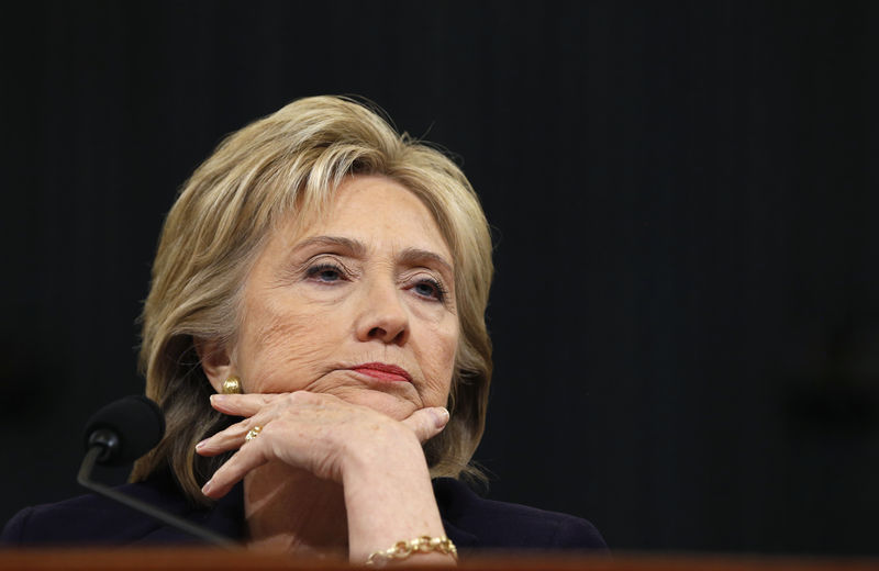 © Reuters. Democratic presidential candidate Hillary Clinton listens to a question as she testifies before the House Select Committee on Benghazi on Capitol Hill in Washington