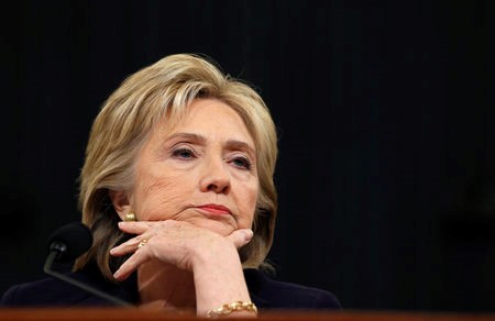 © Reuters. Democratic presidential candidate Hillary Clinton listens to a question as she testifies before the House Select Committee on Benghazi on Capitol Hill in Washington