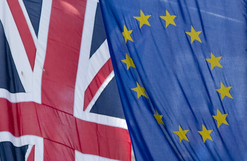 © Reuters. File photograph of the Union Flag flying next to the European Flag outside the European Commission building in London