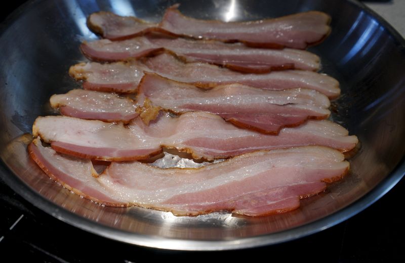 © Reuters. Photo illustration of bacon is fried up in a pan in a kitchen in Golden