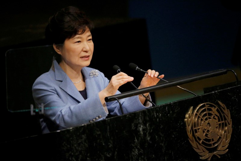 © Reuters. South Korea's President Park Geun-hye adjusts the microphones as she addresses attendees during the 70th session of the United Nations General Assembly at the U.N. headquarters in New York