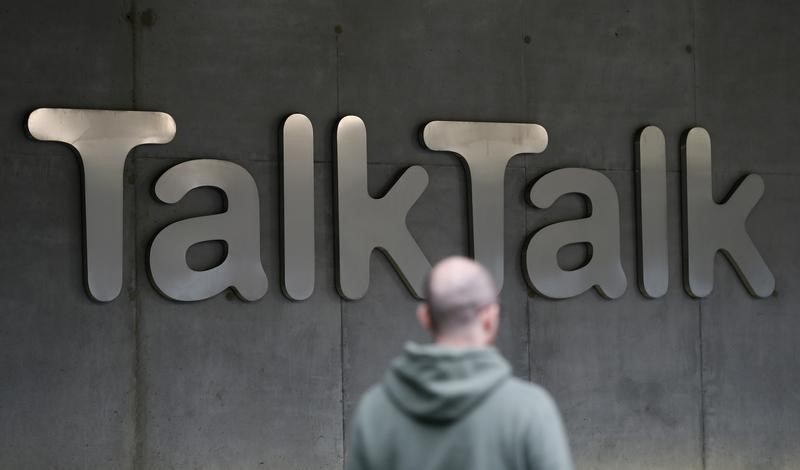 © Reuters. A man walks past a company logo outside a TalkTalk building in London
