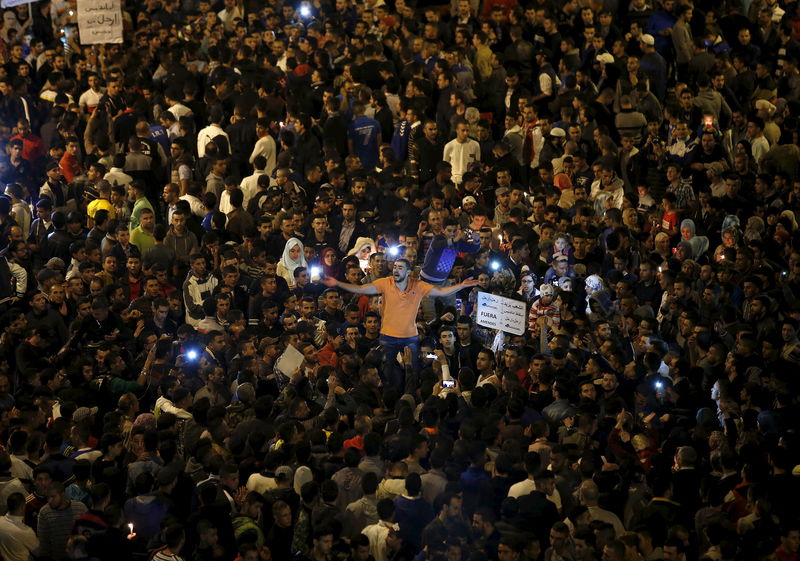 © Reuters. A protesters shout slogans during a demonstration against the power utility company Amendis in Tangier 