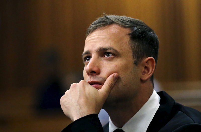 © Reuters. File photo of Olympic and Paralympic track star Oscar Pistorius looking on ahead of his sentencing hearing in Pretoria
