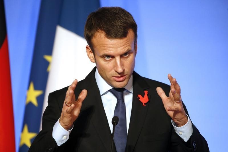 © Reuters. French Economy Minister Emmanuel Macron delivers his speech at the Elysee Palace in Paris