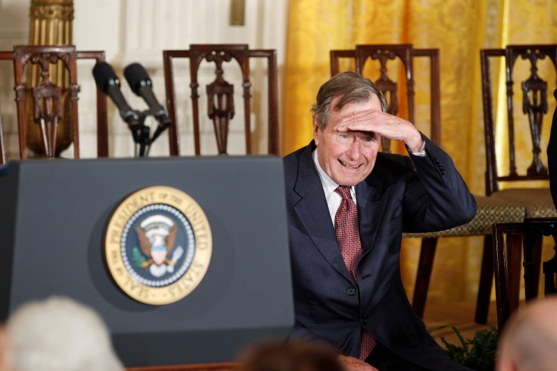 © Reuters. Former U.S. President George H.W. Bush looks attends the Medal of Freedom ceremony at the White House in Washington