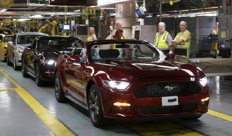 © Reuters. An assembly worker drives a 2015 Ford Mustang vehicle off the production line at the Ford Motor Flat Rock Assembly Plant in Flat Rock, Michigan,
