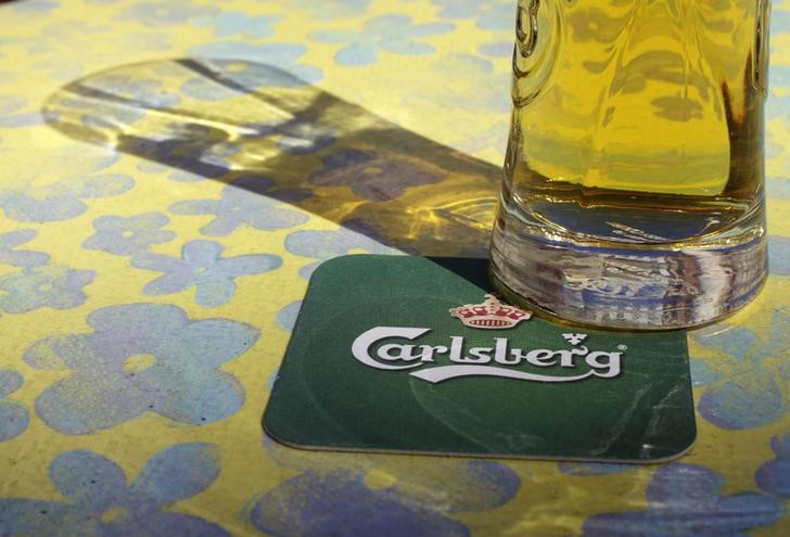 © Reuters. Carlsberg's company logo is pictured on a coaster in the bar in Riga