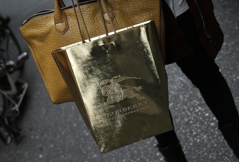 © Reuters. A shopper carries a Burberry shopping bag along Fifth Avenue in New York