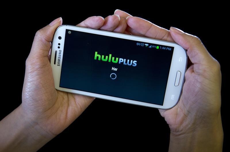 © Reuters. The HULU Plus app is played on a Samsung Galaxy phone in this photo-illustration in New York