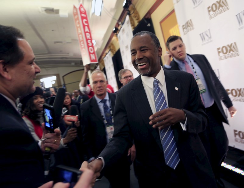 © Reuters. Republican Presidential candidates Ben Carson takes questions from the media in the spin room after the debate held by Fox Business Network for the top 2016 U.S. Republican candidates