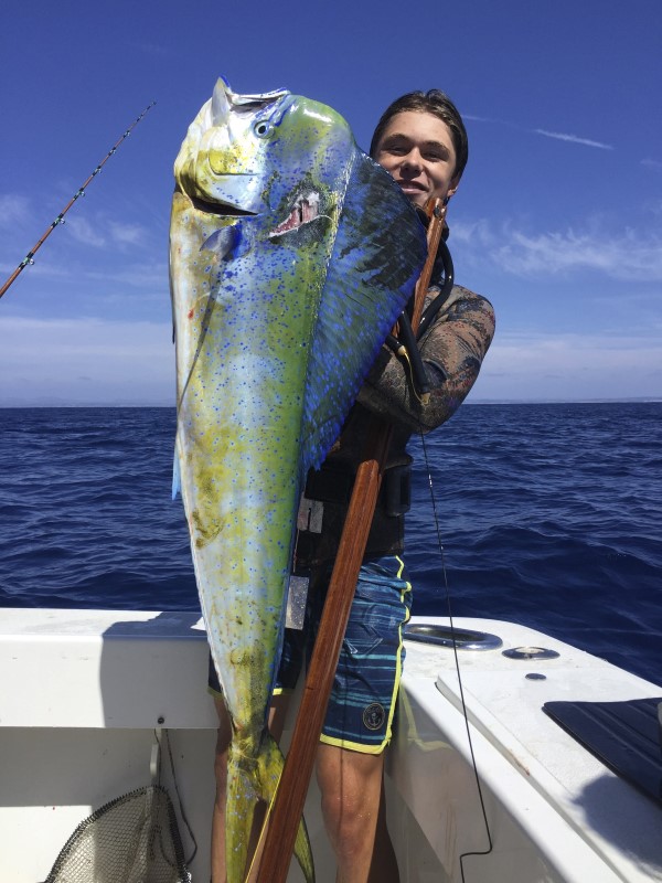 © Reuters. Handout photo of Ryder DeVoe holding up dorado fish he caught free diving off the coast of  San Diego, California