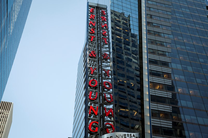 © Reuters. The Ernst & Young building rises above Times Square in New York