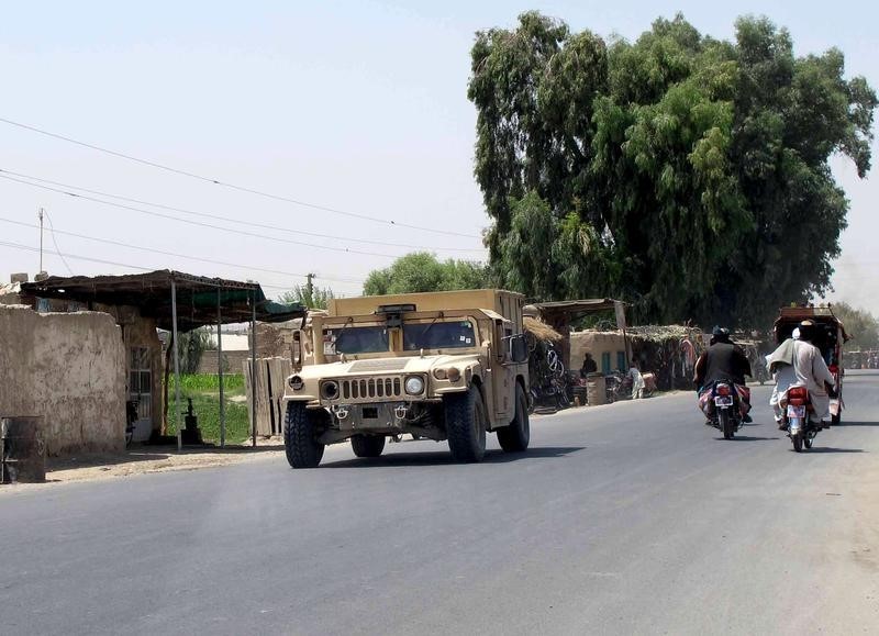 © Reuters. Afghan National Police armored vehicle patrols on a street in Lashkar Gah capital of Helmand