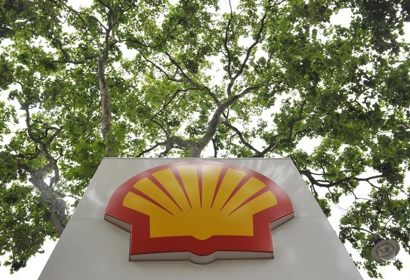 © Reuters. A logo is seen under a canopy of trees at a Shell petrol station in central London