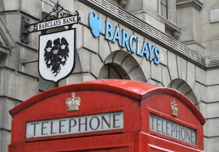 © Reuters. Logos are seen outside a branch of Barclays bank in London