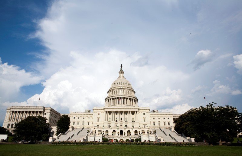 © Reuters. Clouds pass over Capitol Hill in Washington