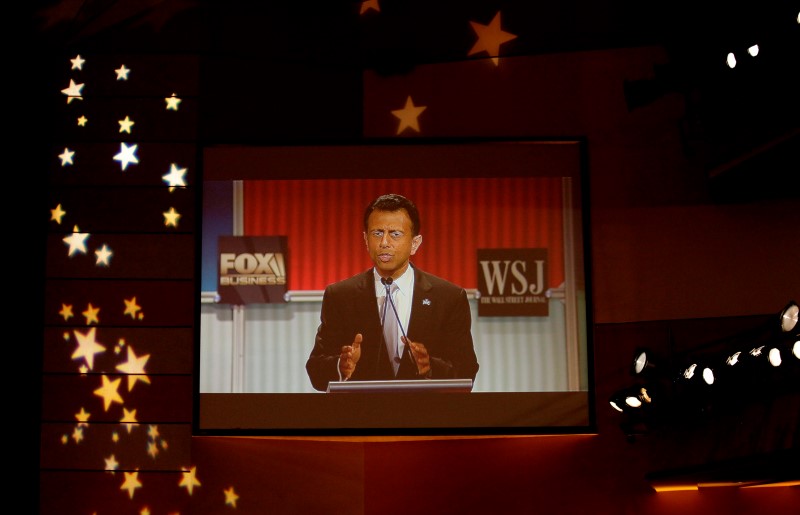 © Reuters. Republican U.S. presidential candidate Jindal is seen on a video monitor during a forum for lower polling candidates held by Fox Business Network before the U.S. Republican presidential candidates debate in Milwaukee