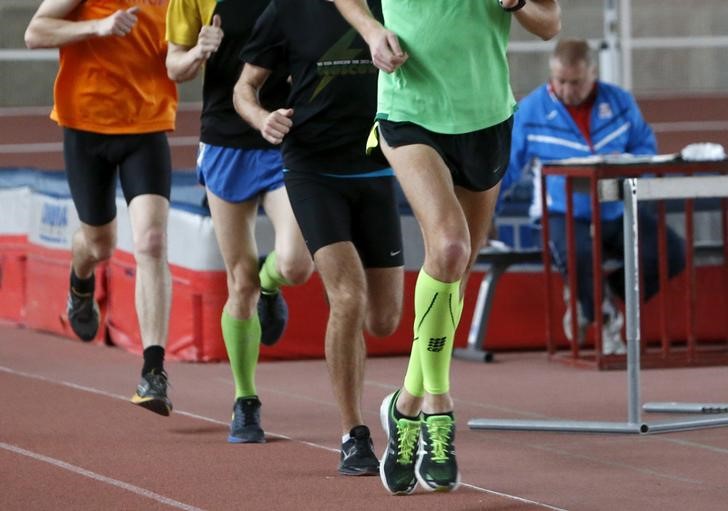 © Reuters. Sportsmen run during a training session at the Brothers Znamensky Olympic Centre in Moscow