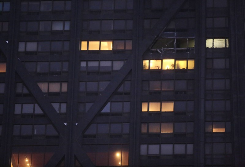 © Reuters. Windows are seen missing from the 50th floor of the John Hancock Center after a 2-11 alarm fire was extinguished by firefighters in Chicago
