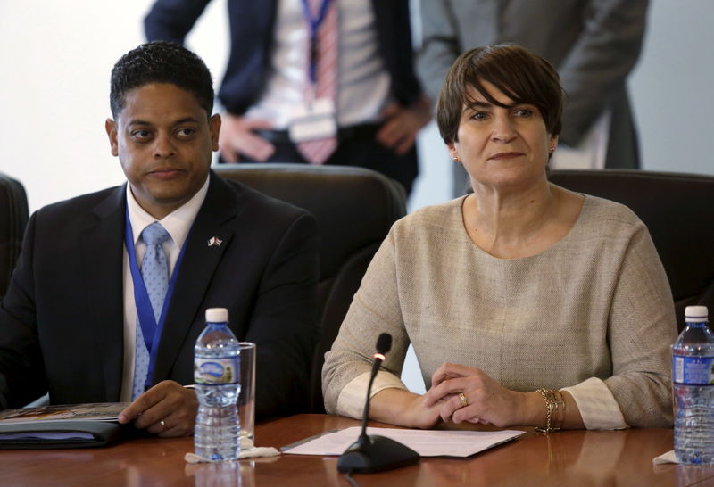© Reuters. Dutch Minister for Foreign Trade and Development Lilianne Ploumen and Curacao's Minister of Economic Development Eugene Rhuggenaath, attend a meeting with Cuban port authorities at Mariel Port in Artemisa province