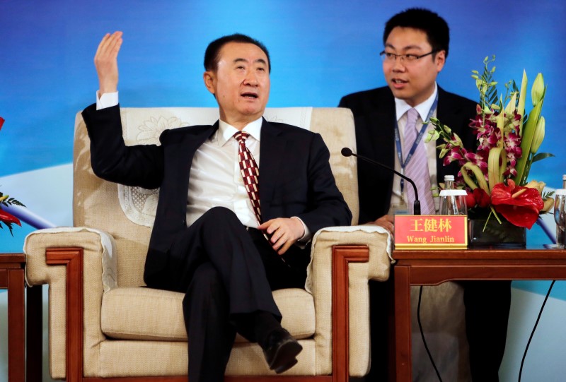 © Reuters. Wang gestures as he speaks in Beijing