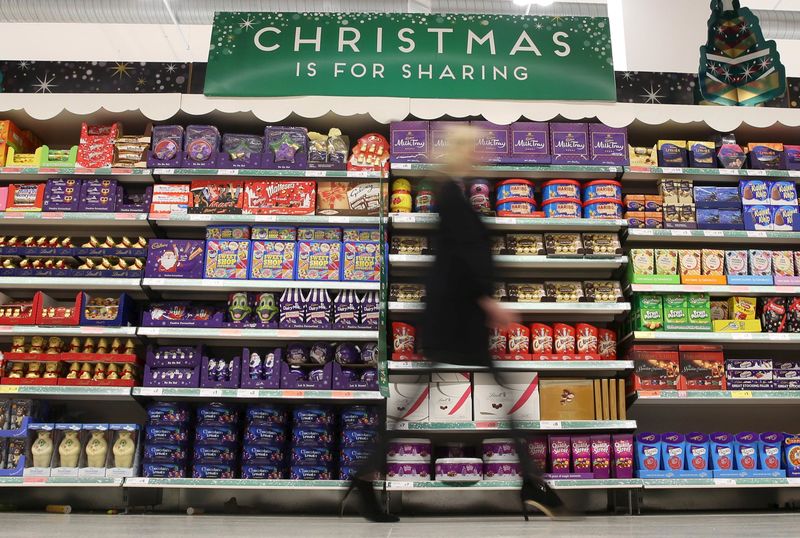 © Reuters. File photograph of a woman shopping at a Sainsbury's store in London