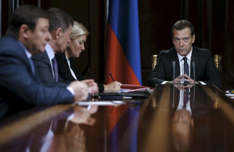 © Reuters. Russian PM Medvedev chairs a meeting outside Moscow