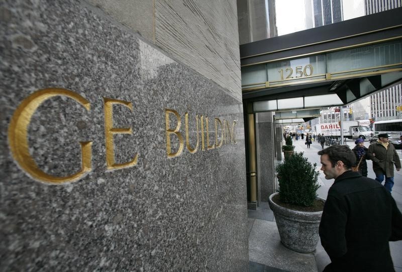 © Reuters. A man enters the General Electric building at 1250 Avenue of the Americas, also known as 30 Rockefeller Plaza in New York