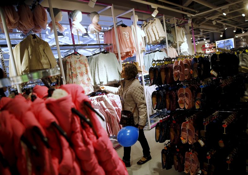 © Reuters. File photo of a woman looking at clothes after the opening of Primark's new Spanish flagship store in Madrid