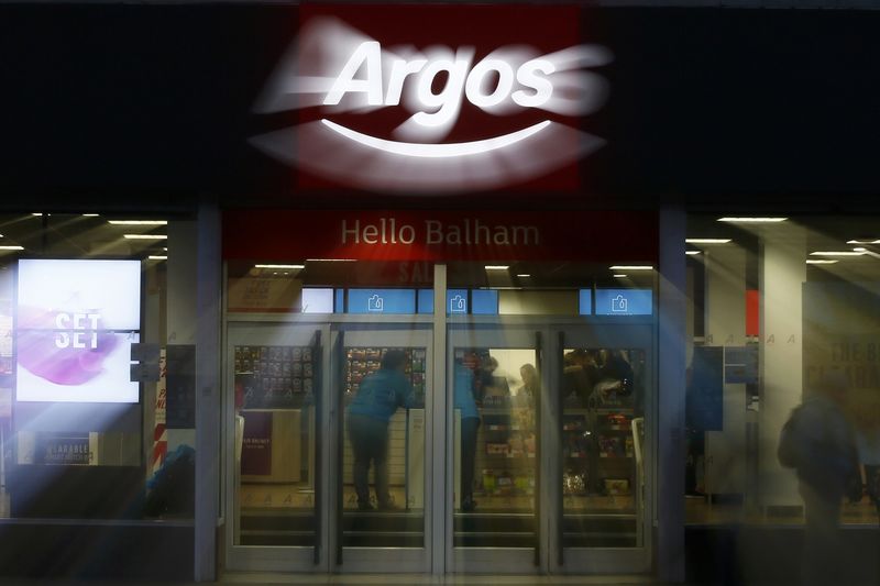 © Reuters. An illuminated sign is seen at an Argos store in London