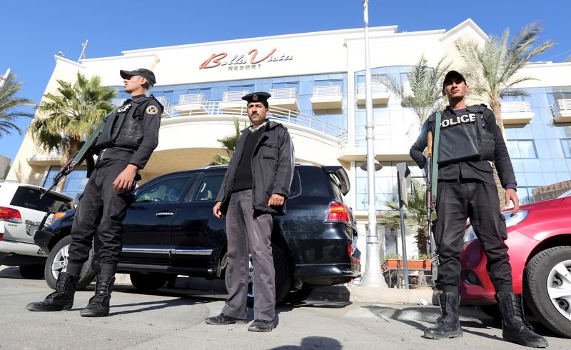 © Reuters. Egyptian security personnel guard the entrance to the Bella Vista Hotel in the Red Sea resort of Hurghada